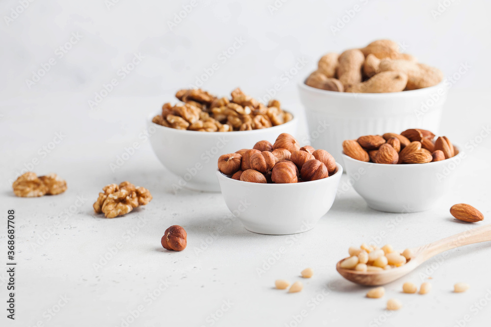 Assorted nuts. The dried nuts, hazelnuts, almonds, walnuts and others. Healthy food, healthy snacks. Copy space. Assorted nuts. The dried nuts, hazelnuts, almonds, walnuts and others. Healthy food, healthy snacks. Copy space.