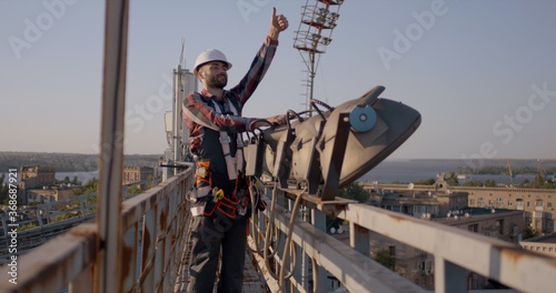 Engineer working on a cellular tower
