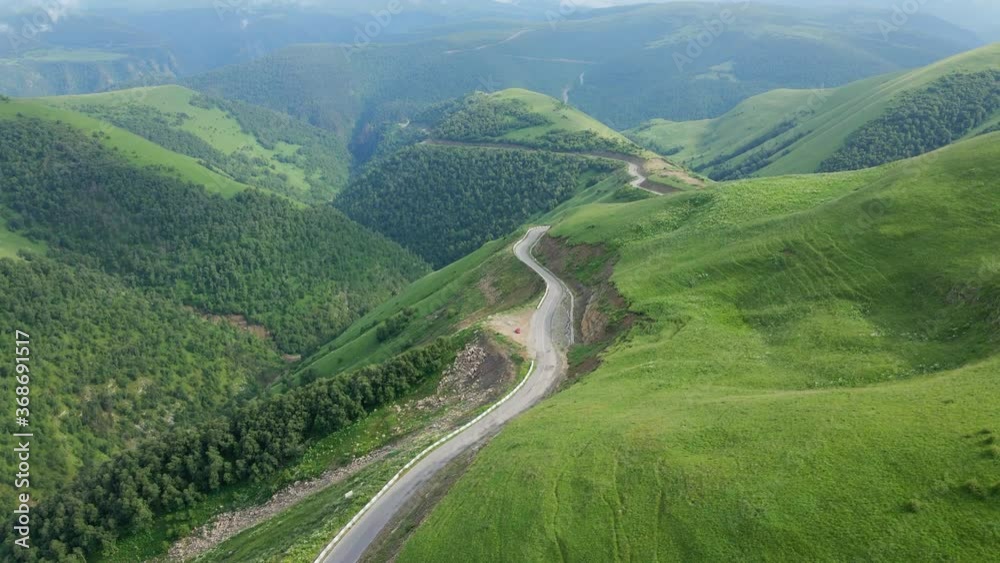 view of the green Caucasus mountains in summer from the sky with a drone in the afternoon view of the green Caucasus mountains in summer from the sky with a drone in the afternoon