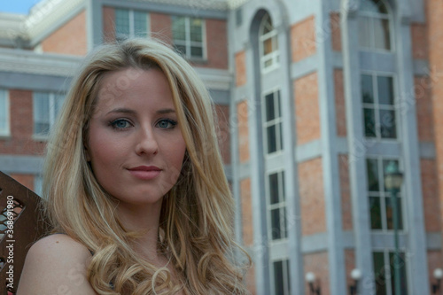 A beautiful confident woman outside of an office building