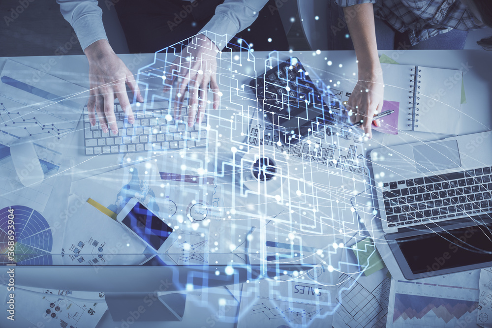 Double exposure of man and woman working together and human brain hologram drawing. Brainstorm concept. Computer background. Top View.