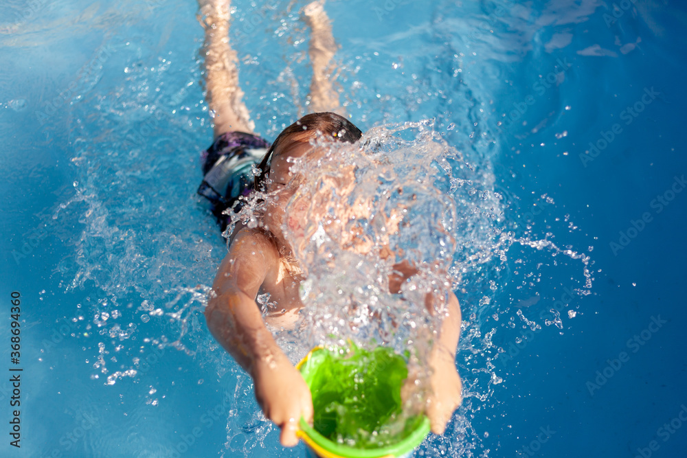 kid have fun in swimming pool stock photo