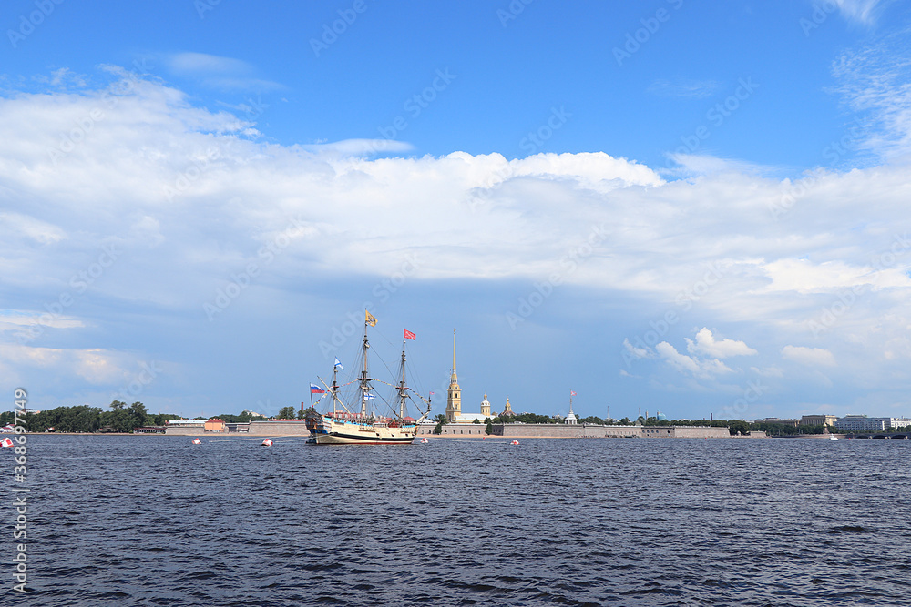 Russia, St. Petersburg, July 19, 2020. Military brig Poltava and the Peter and Paul Fortress in the water area of the Neva during the parade to the Day of the Navy