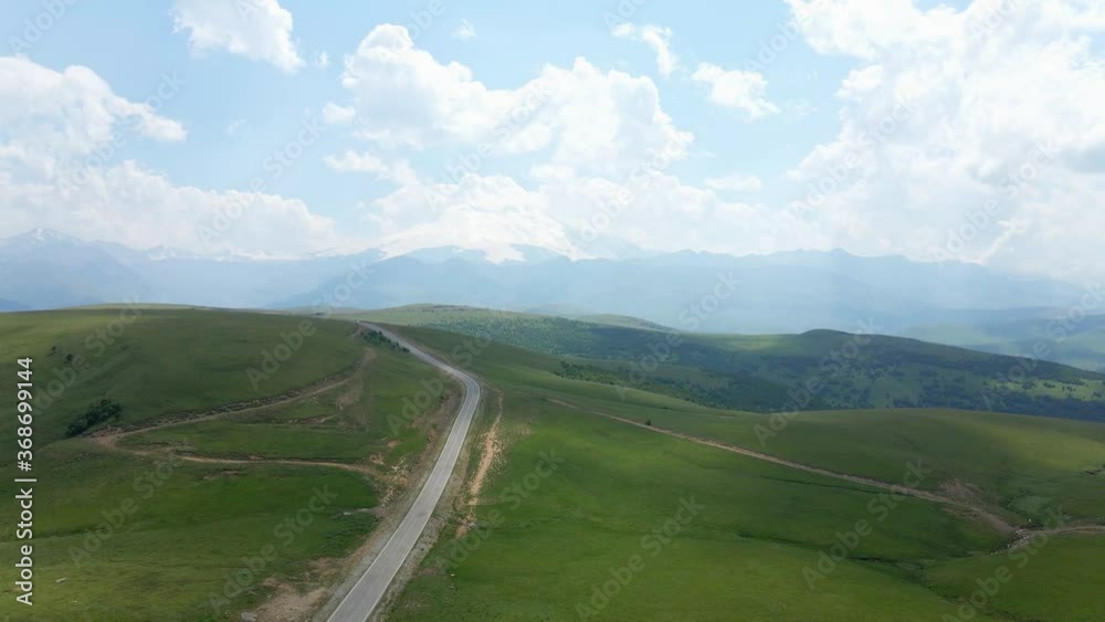 view of the green Caucasus mountains in summer from the sky with a drone in the afternoon view of the green Caucasus mountains in summer from the sky with a drone in the afternoon