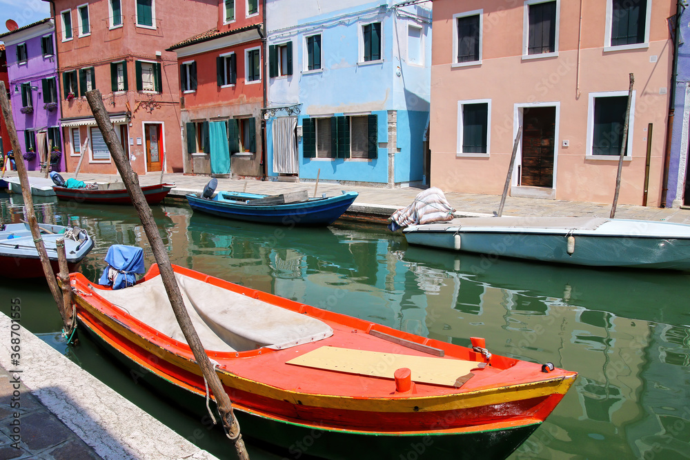 Boat anchored in canal in Burano, Venice, Italy