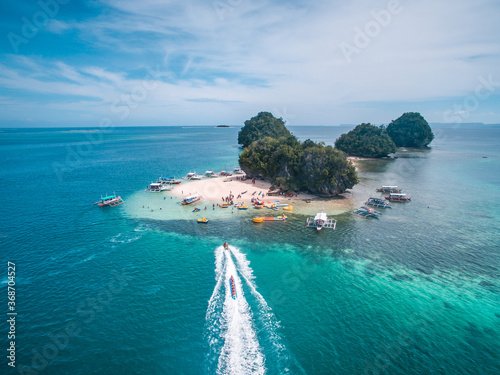 Aerial view of Boslon Island, Salvacion, Surigao del Sur, Philippines photo