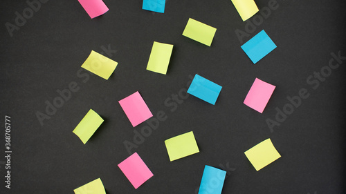 colorful sticky notes on black background