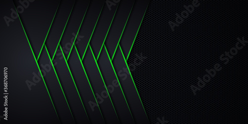 Modern abstract futuristic hexagon carbon fiber and glowing light green luminous lines in black dark room technology background