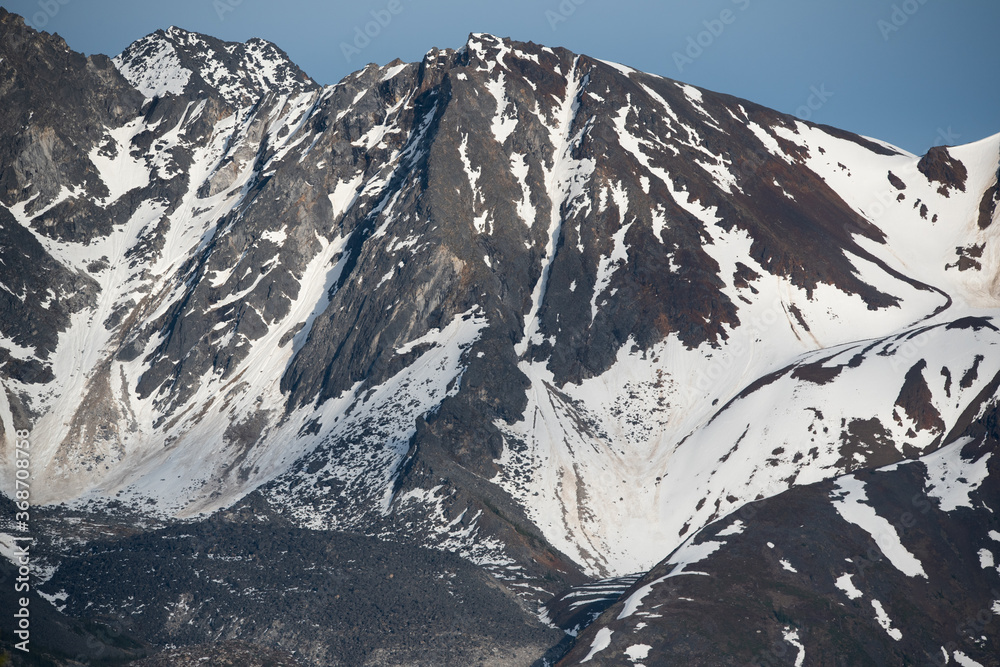 Beautiful snow capped mountain close up taken in the summer in Yukon Territory, Canada. 