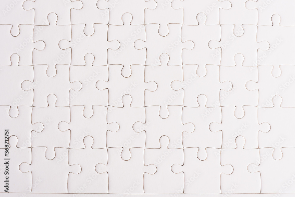 Top view flat lay of paper plain full white jigsaw puzzle game texture background, quiz calculation concept Top view flat lay of paper plain full white jigsaw puzzle game texture background, quiz calculation concept