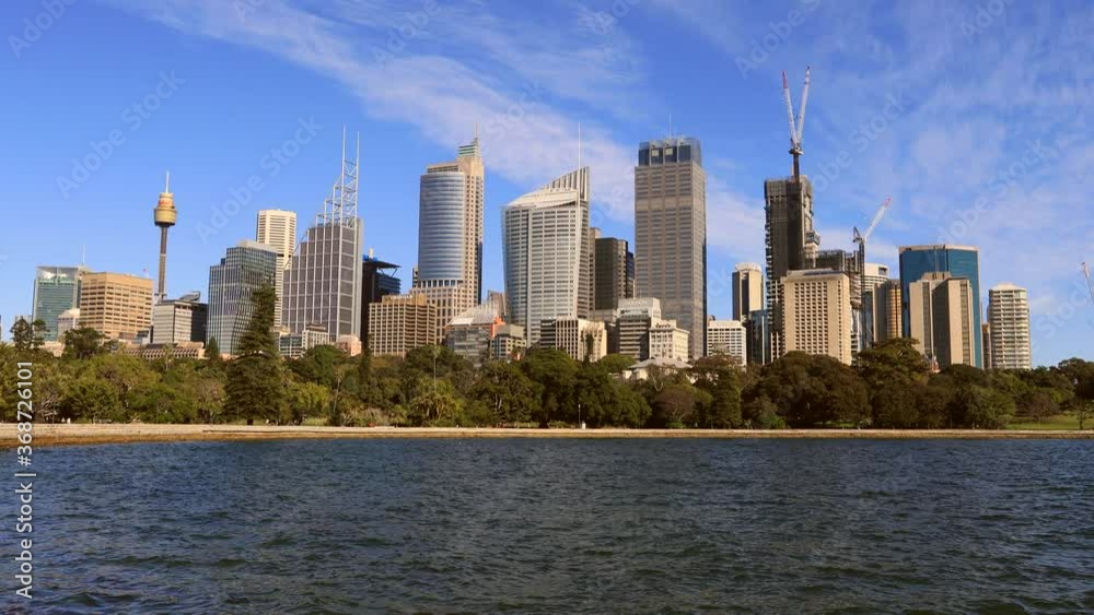 Zoom in to towers of Sydney city CBD waterfront on a sunny day as 4k.
Zoom in to towers of Sydney city CBD waterfront on a sunny day as 4k.