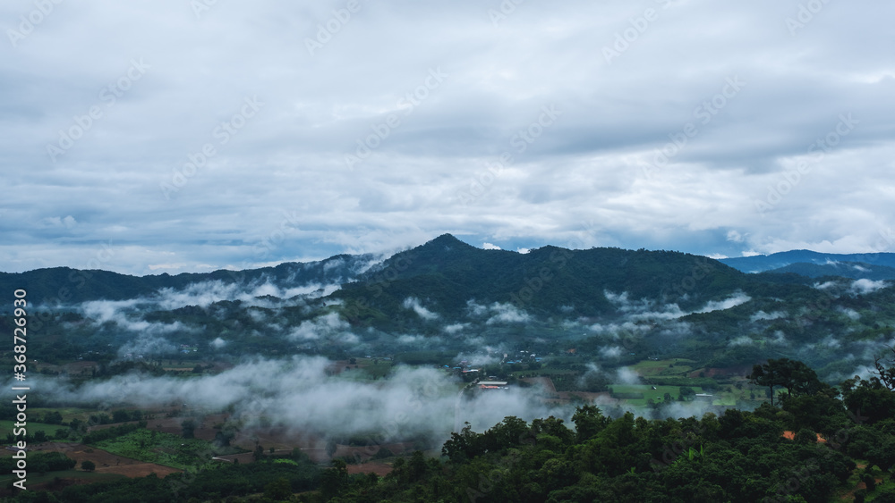 Landscape image of foggy greenery rainforest mountains and hills Landscape image of foggy greenery rainforest mountains and hills