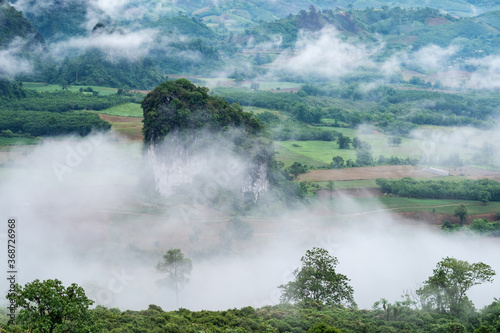 Landscape image of foggy greenery rainforest mountains and hills