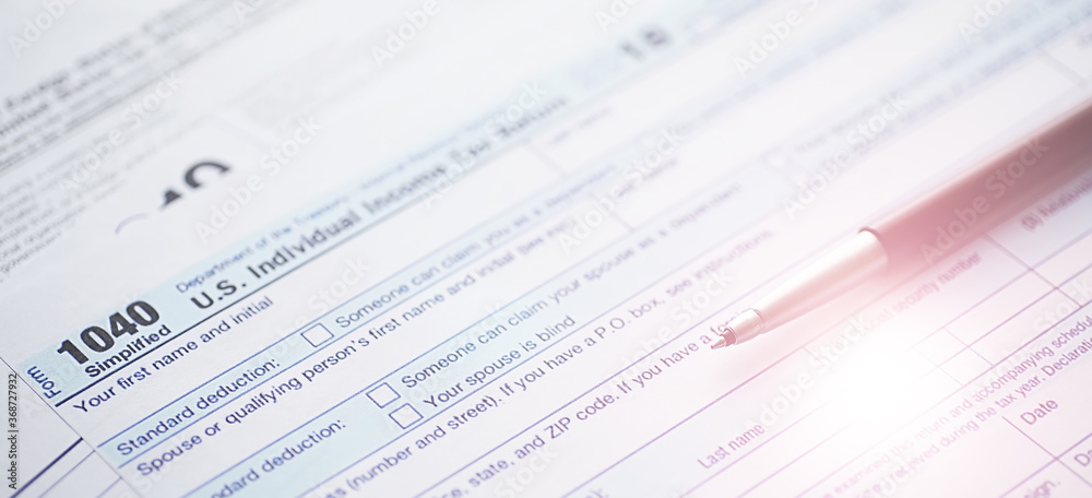 Annual tax reporting. Tax form on the table. Financial statements for signature. Annual tax reporting. Tax form on the table. Financial statements for signature.