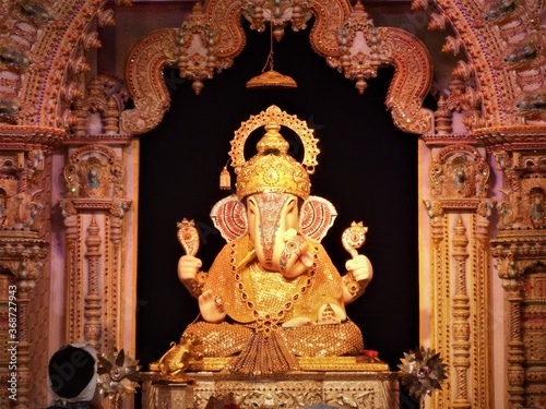 Ganesha,Dagdusheth ganpati,pune,Ganesh festival,ganesh chaturthi,indian festival,ganesh chaturthi,lord ganesha,ganesh,indian culture,ganpati pandal,prayer,man praying,golden ganesha,temple,statue photo