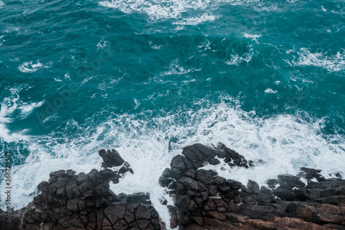 View from above, rocky coast, turquoise sea.