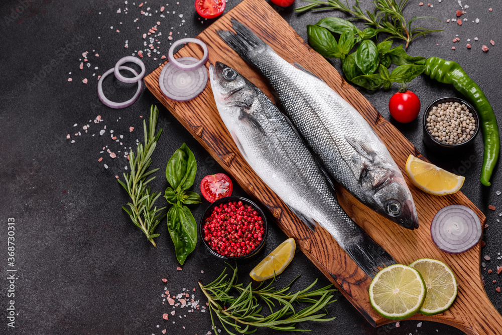 Ταπετσαρία Fresh fish seabass and ingredients for cooking. Raw fish seabass