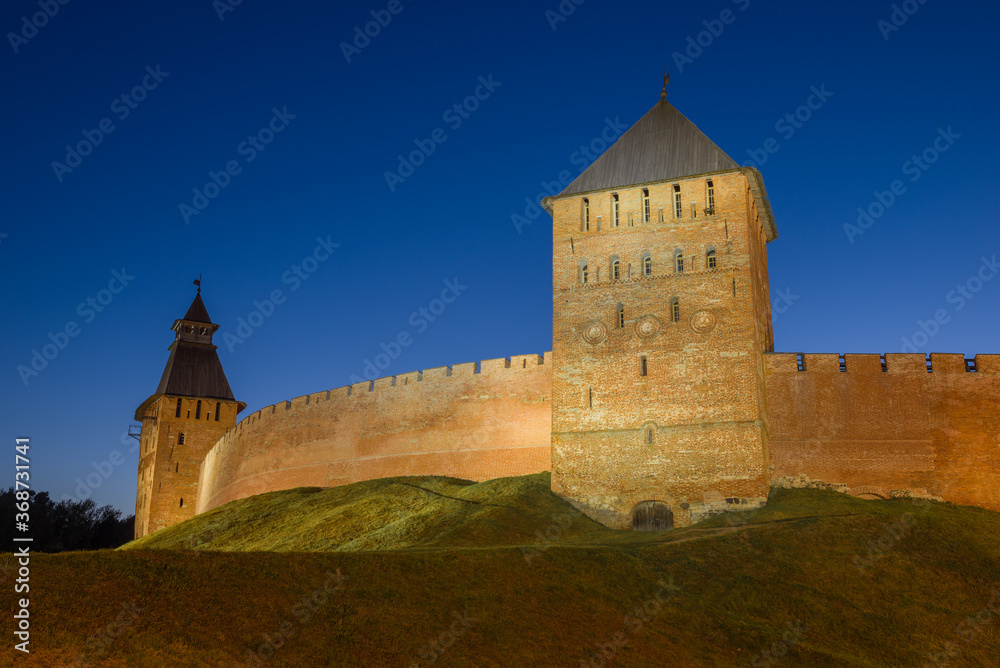 Towers and walls of the Kremlin of Veliky Novgorod on a July night. Russia