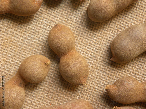 Brown color raw whole dried Tamarind fruit in shell