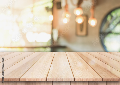 Empty wooden top table with on blur restaurant background