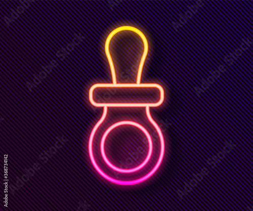 Glowing neon line Baby dummy pacifier icon isolated on black background. Toy of a child. Vector.