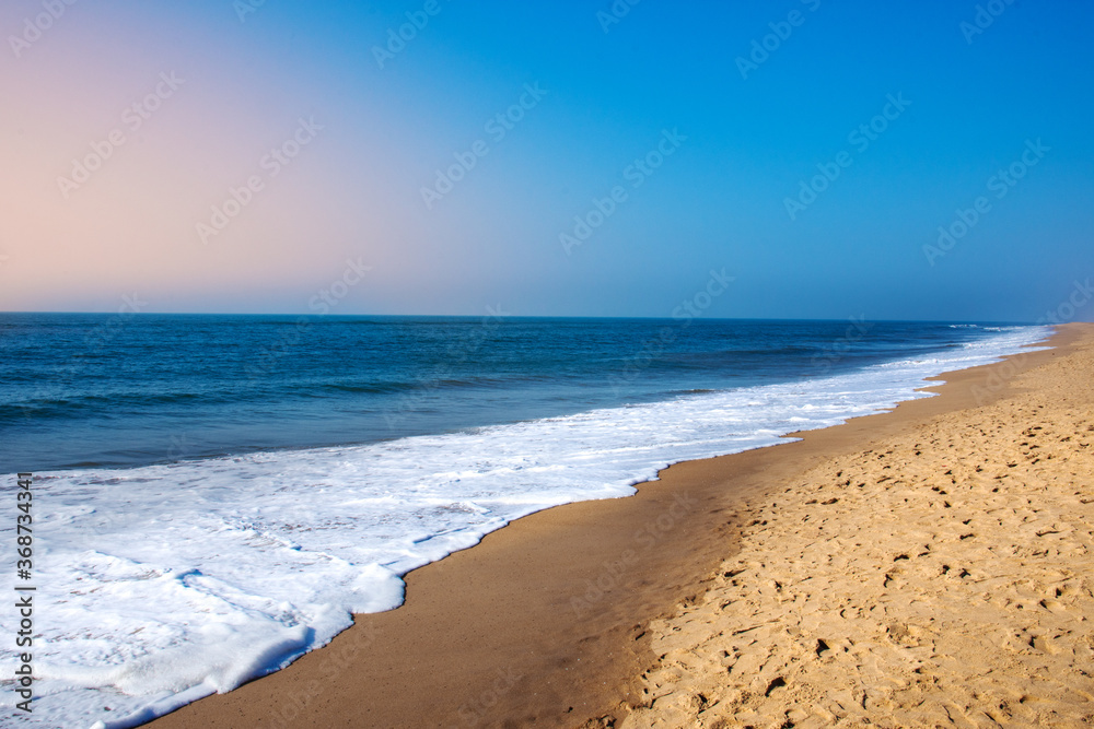Beautiful Goa Sea beach and water waves at the time of Sunset.