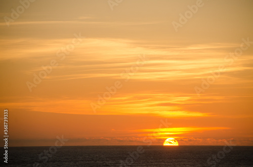 Low sun disk at sunset near Westport Lighthouse State park