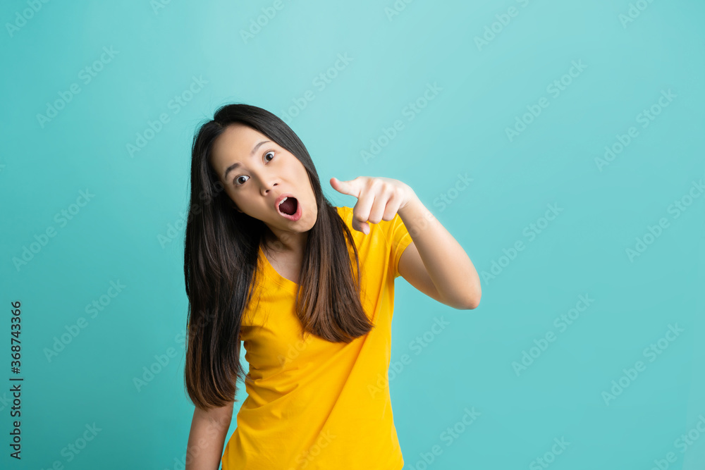 Asian woman. She is pointing in front needs. Asian woman. She is pointing in front needs.