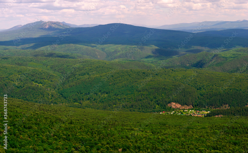 Nice panoramic view from the top of the mountain range. Ural mountains. Russia.