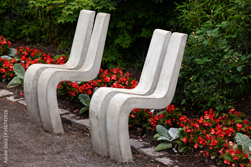 strange seats in park made of concrete photo