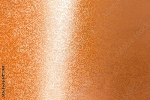 Shiny orange paper with Chineses style pattern background, abstract paper texture background