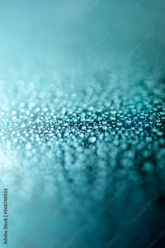 Water Droplets Texture. Rain Drops on Glass Window Background. Vertical photo. Selective Focus Water Droplets Texture. Rain Drops on Glass Window Background. Vertical photo. Selective Focus