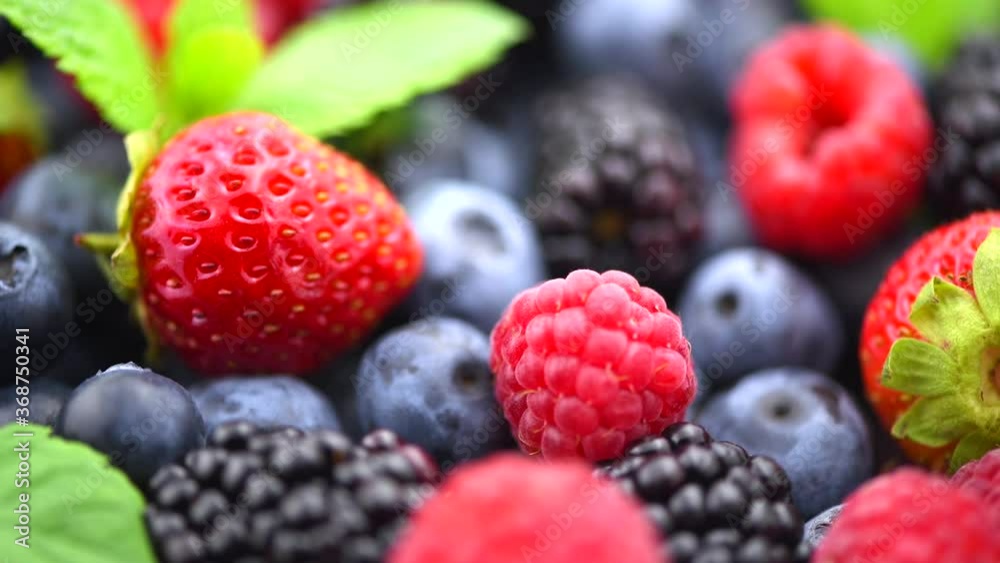 Berries. Various colorful berries rotation background. Mint leaves, Strawberry, Raspberry, Blackberry, Blueberry close-up rotating backdrop. Fresh Bio Fruits, Healthy eating, diet. 4K UHD video Berries. Various colorful berries rotation background. Mint leaves, Strawberry, Raspberry, Blackberry, Blueberry close-up rotating backdrop. Fresh Bio Fruits, Healthy eating, diet. 4K UHD video