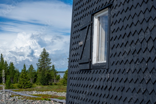 Northern Sweden Archipelago Stor-Rabben Lighthouse and Navigation House Isolated on a Island Outside of Pitea In Beautiful Scandinavian Nature Reserve.  photo