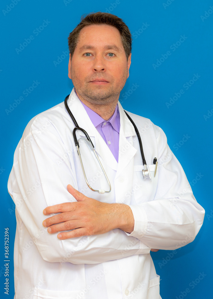 vertical image Photo of brunet hair bristle doc assistant folded hands over chest stand isolated blue background vertical image Photo of brunet hair bristle doc assistant folded hands over chest stand isolated blue background