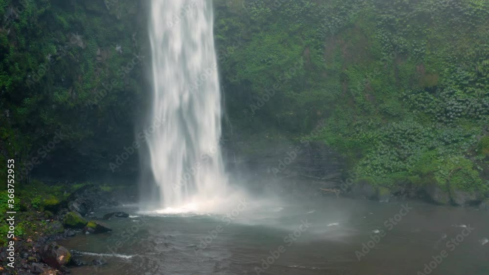 Nungnung Waterfall is located in the mountains of the North of Bali in the Bedugul region. Bali, Indonesia. 4K Nungnung Waterfall is located in the mountains of the North of Bali in the Bedugul region. Bali, Indonesia. 4K