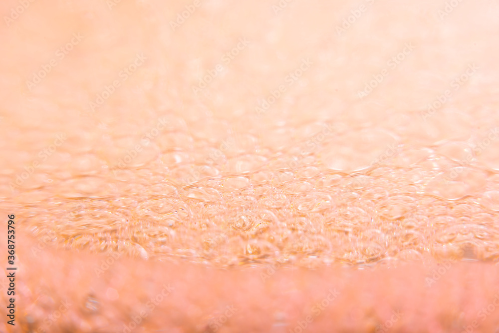 Blurred abstract light background with pink bubbles. The concept is summer, soft drinks, freshness. For the backing of a site or mobile application. Blurred abstract light background with pink bubbles. The concept is summer, soft drinks, freshness. For the backing of a site or mobile application.