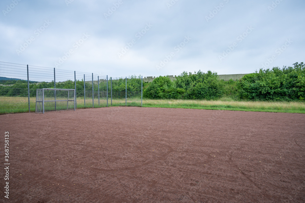 soccer field with metal goal and metal fence for youngsters to play soccer field with metal goal and metal fence for youngsters to play