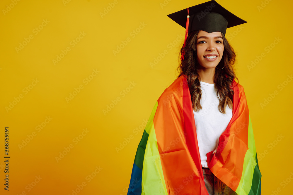 Beautiful African American Lesbian Girl In A Graduation Hat Posing With Lgbt Rainbow Flag On A