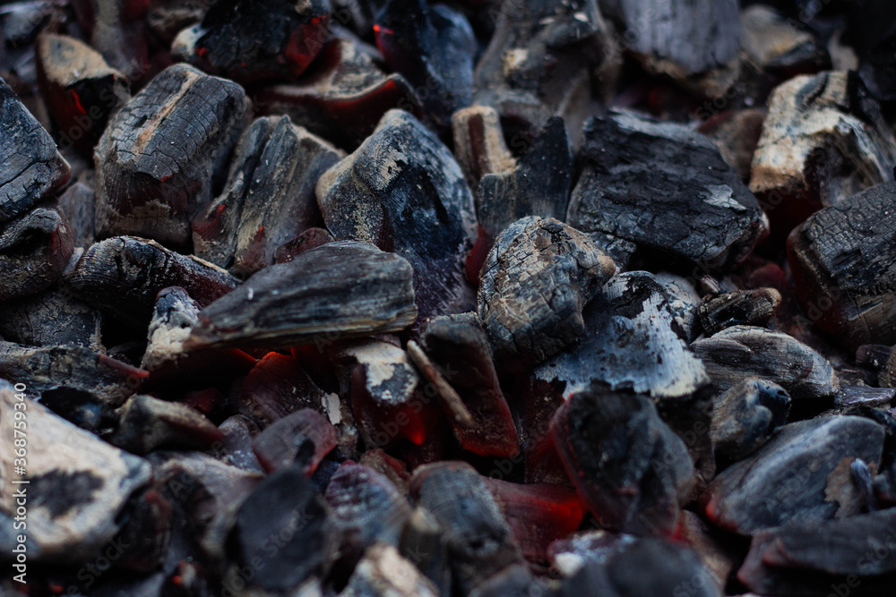 Black hot coal, close-up. Black charcoal background