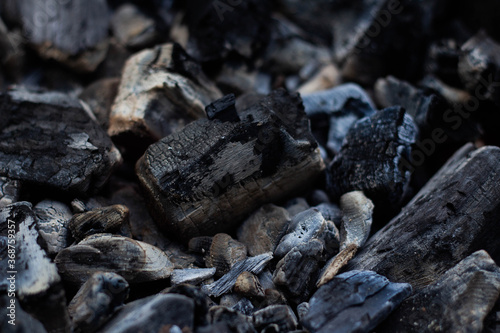 Black hot coal, close-up. Black charcoal background