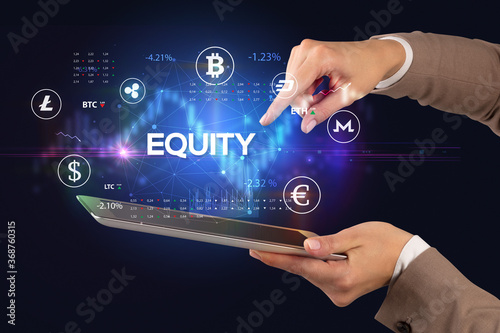 Close-up of a touchscreen with EQUITY inscription, business opportunity concept