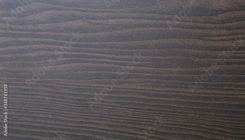 Pattern and texture of brown and black wood.