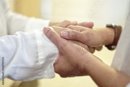 Couple holding hand, caring, praying