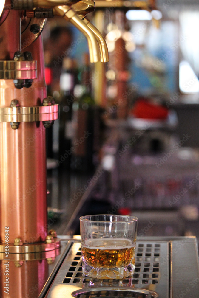 Bartender serving a beer rod from a tap Bartender serving a beer rod from a tap