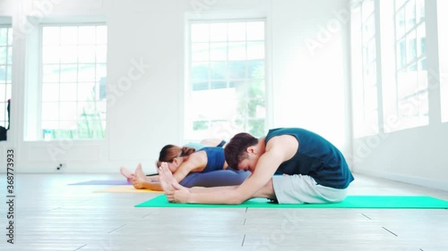 Group of multi ethnic people workout yoga together. 