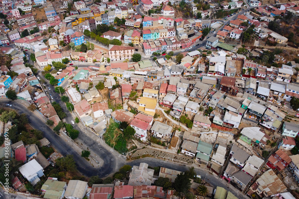 Aerial view of historic district of Valparaiso. Colorful houses on the hills with curved road and streets view from above. Valparaiso, Chile.