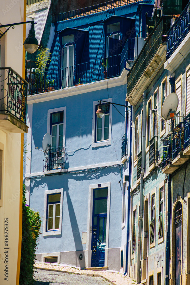 View of classic facade of ancient historical buildings in the downtown area of Lisbon, the hilly coastal capital city of Portugal and one of the oldest cities in Europe
