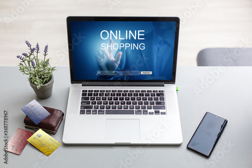 online shopping or internet shop concepts, with a laptop