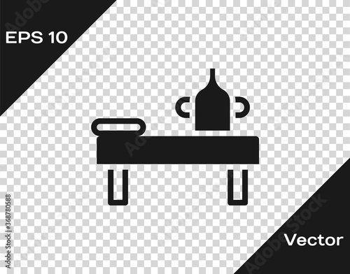 Black Massage table with oil icon isolated on transparent background. Vector.